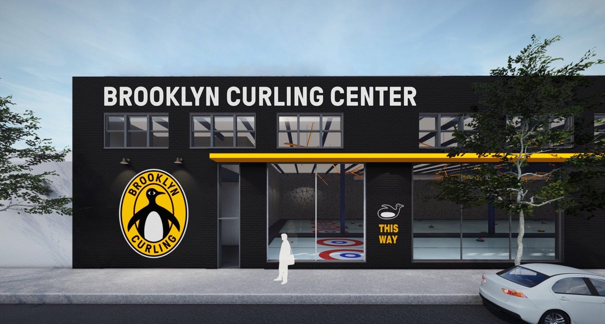 A rendering of the Brooklyn Curling Center. A large, warehouse type building, with a cute penguin logo and large windows showing the ice sheets.