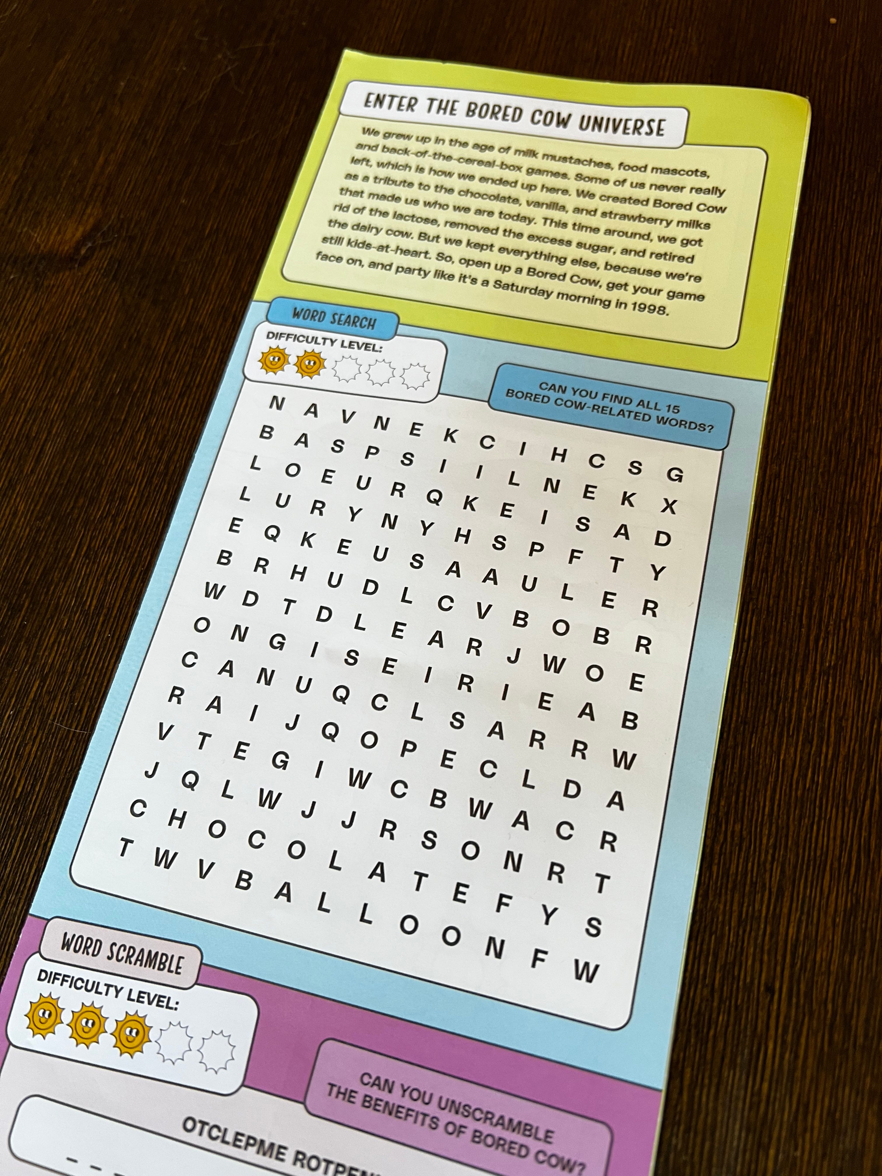 The Bored Cow activity booklet, unfolded to show the word search.