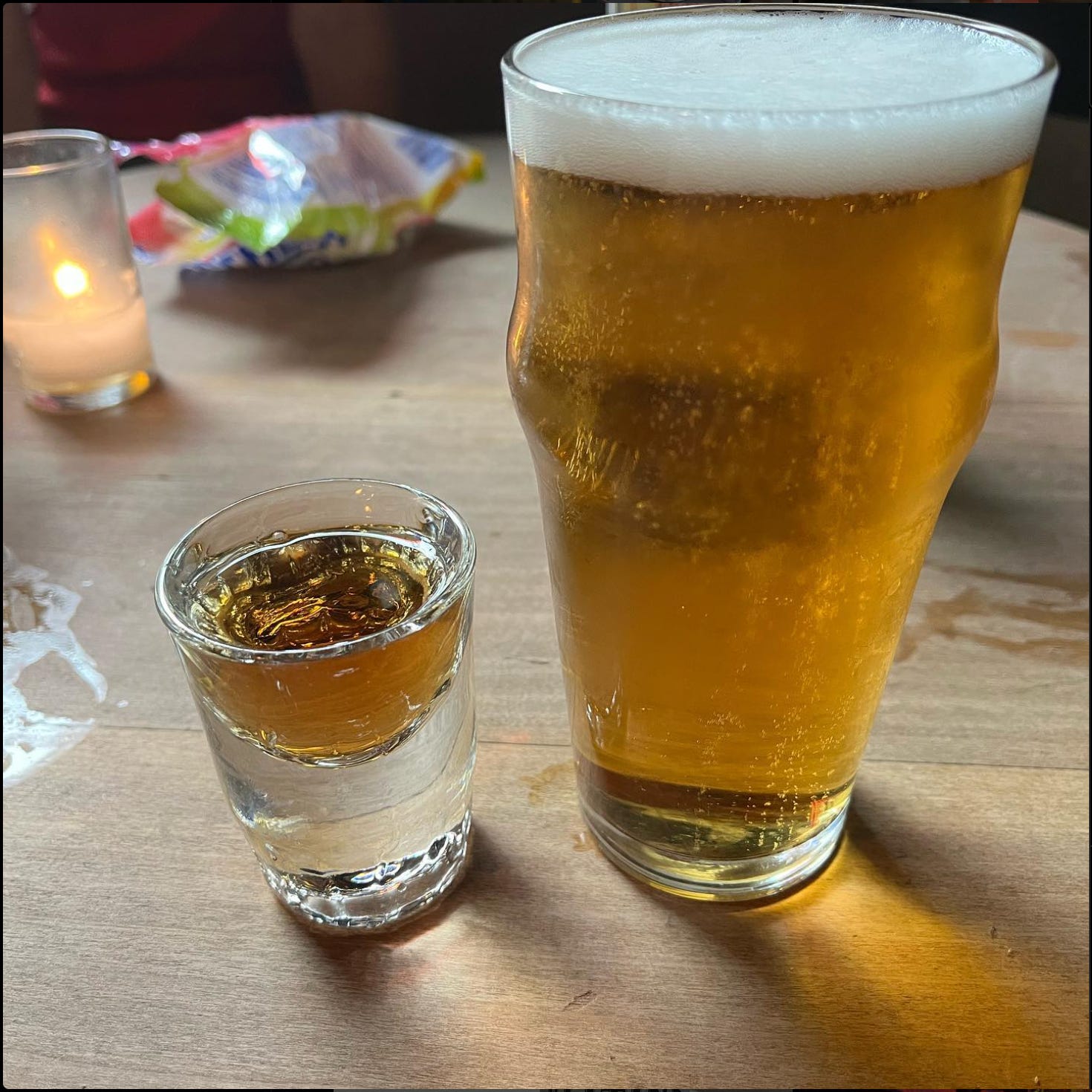 A shot and draft beer glass.