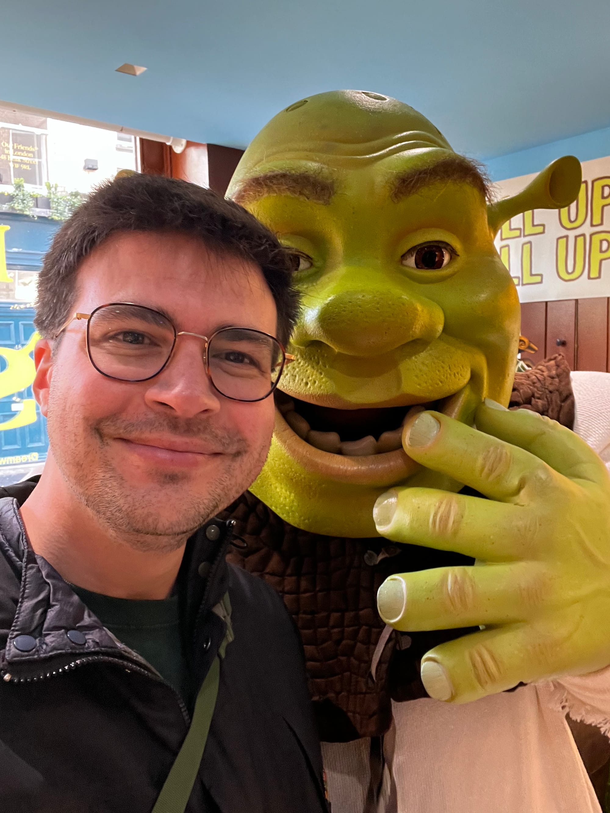 The author poses for a selfie with Shrek.