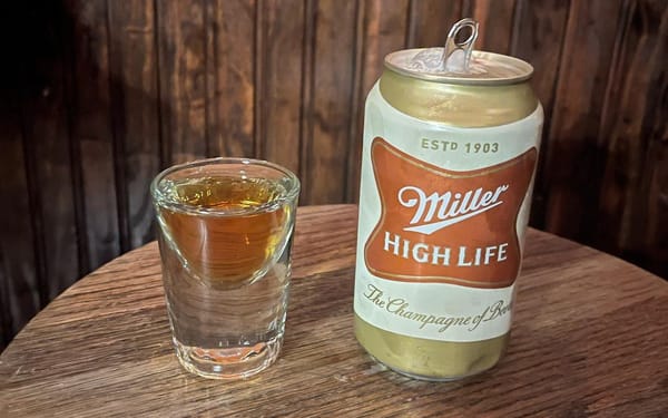 A shot of whisky and a can of Miller High Life.