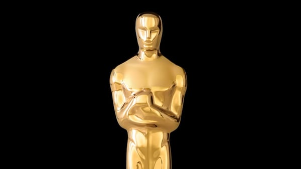 A close-up photo of the Oscar statuette, a gold little man.